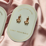 Bow Huggie Hoop Earrings in Gold